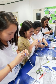 Theory combined with hands-on training. Participants build a home-made priming device during a Wageningen University & Research organised course on seed technology provided in the Philippines.  